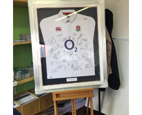 A 2015 ENGLAND WORLD RUGBY SHIRT SIGNED BY ALL 50 OF THE SUMMER SQUAD. THIS ITEM IS BEING SOLD ON BEHALF OF 'THE BIG C' CHARI