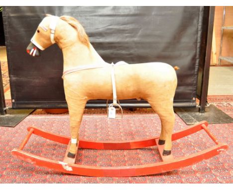 A VINTAGE STRAW-FILLED ROCKING HORSE WITH HAIR MANE AND TAIL ON A RED PAINTED ROCKING BASE, 80 CM REQUIRES SOME CARE AND ATTE