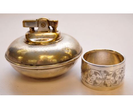 A SILVER TABLE LIGHTER TOGETHER WITH ENGRAVED SILVER NAPKIN RING