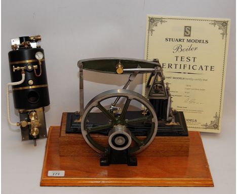 A STUART TURNER HORIZONTAL HALF BEAM STEAM ENGINE WITH 18CM FLYWHEEL PAINTED BLACK, MOUNTED ON WOODEN BASE WITH A STUART BOIL
