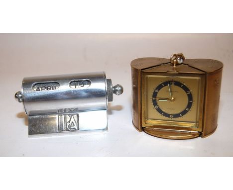 GILT CASED TRAVELLING CLOCK BY EUROPA, 8 DAY MOVEMENT WITH ALARM FEATURE, HOUSED IN AN UNUSUAL CASE, ART DECO ALLOY DESK CALE