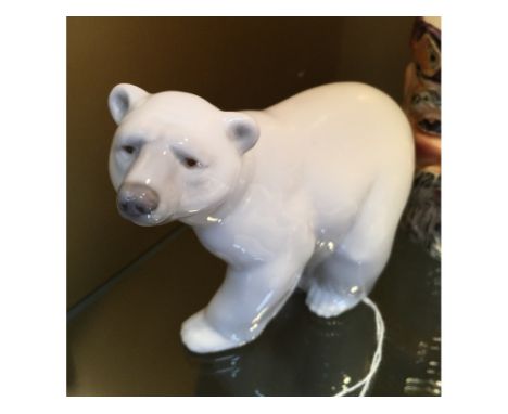 A Lladro Attentive Polar Bear, 10 cm high, two Nao figures, four character jugs, other figures, four Carlton Ware Royal items