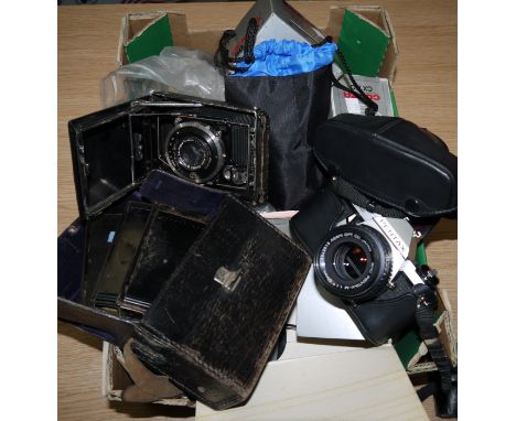 A vintage German folding camera with plate holders; a Pentax ME, and an ME super camera; etc.