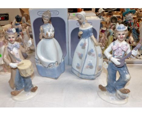 Two Leonardo Collection figures: clowns playing instruments; and 2 female figures (a.f.)