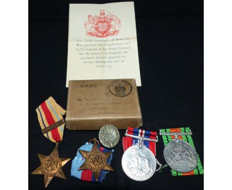 A WWII Group of 4 in box of issue to Mr. S. Walker with 8th Army clasp and Loyal Service Badge