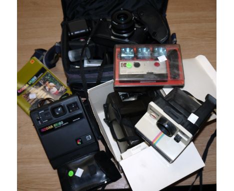 A Pentax ME F. SLR camera; Polaroid cameras, and others