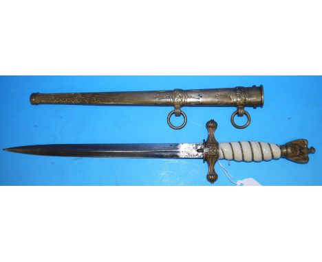 A WWII Nazi Kreigsmarine officer's dagger, unmarked double sided blade with gilt metal mounts, ivorine grip and eagle and swa