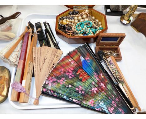 A selection of costume jewellery and cufflinks; fans; a parasol