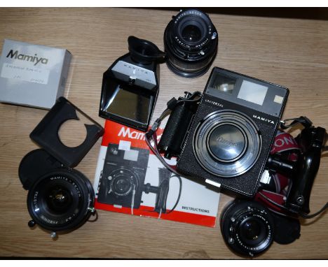 A Mamiya Universal Press 6 x 9 format camera with roll film adapter and 50mm f6.3, 100mm f3.5 and 150mm f5.6 lenses, 50mm vie