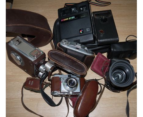 A GB Kershaw camera; a Kodak movie camera; other vintage cameras