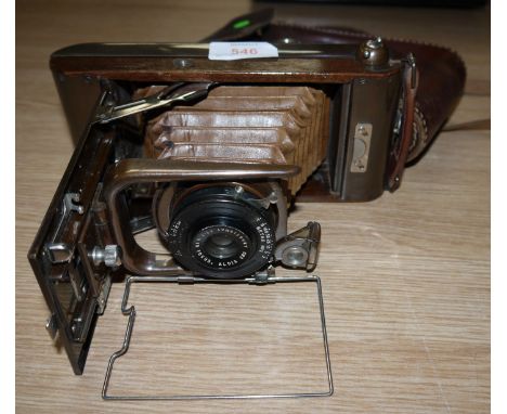A Houghton-Butcher "Ensign Carbine" Tropical Model folding camera in leather case