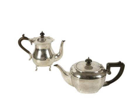 SILVER TEAPOT by Mappin and Webb, Sheffield, 1911, of baluster form, hinged cover, shaped border, turned wooden handle, raise