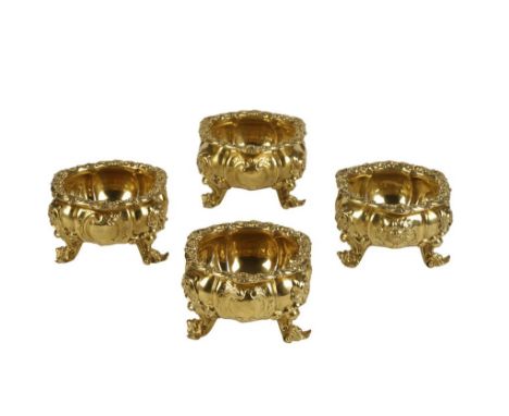 SET OF FOUR GEORGE IV SILVER GILT SALTS, by Paul Storr, London 1827, of cauldron form with cast shell and scroll borders, the