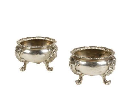 PAIR OF GEORGE IV SILVER SALTS by Paul Storr, London 1820, of circular form with gadrooned borders and scroll-capped feet, cr