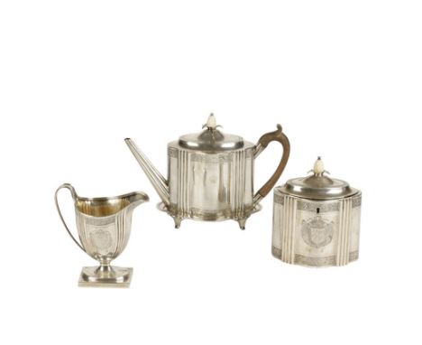 GEORGE III SILVER TEAPOT AND STAND with a tea caddy and cream jug ensuite, by Henry Chawner, London 1793, the teapot of oval 