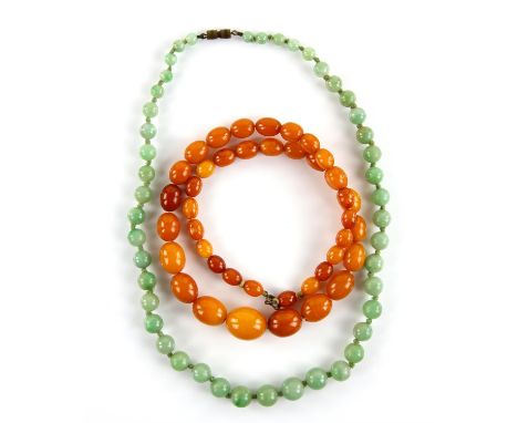 1920's amber necklace, graduated oval beads, largest bead measuring 17 x 14mm, strung without knots, with a base metal bolt r
