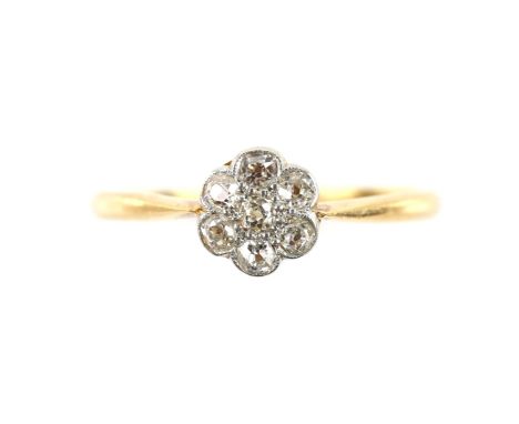 Edwardian flower cluster ring, set with seven old cut diamonds, estimated total weight 0.25 carats, mounted in 18 ct, ring si
