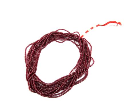 Eleven strand ruby bead necklace, comprising of graduated faceted ruby beads, 36cm long, on plaited cotton cordCondition Repo