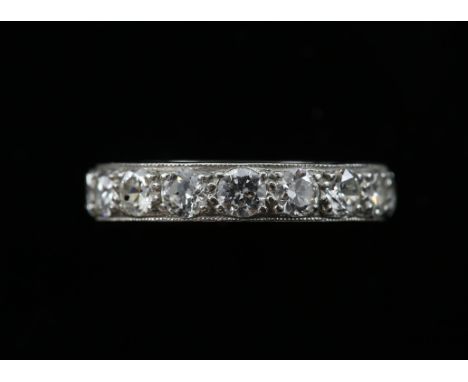 1920's full eternity ring, set with transitional cut diamonds, estimated diamond weight 2.00 carats, side of band decorated i