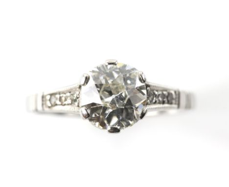 1930's diamond ring, central old cut diamond, estimated weight 1.29 carats, with six Swiss cut diamonds set in shoulders, mou