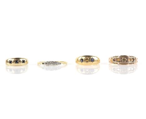 Four antique rings, including a diamond ring stamped 18 ct plat, a three stone ring with sapphires, hallmarked 18 ct Birmingh