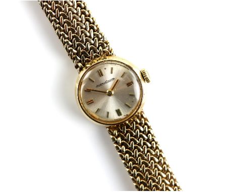 Jaeger Le Coultre ladies wrist watch, signed silver dial with baton hour markers, with a signed mechanical movement, in  a 9 