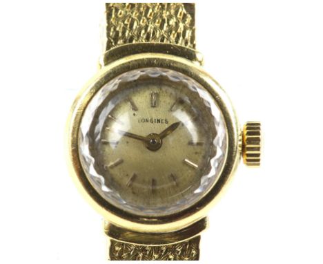Longines, A ladies gold dress watch, the signed circular brushed gold dial, with baton hour markers, fitted with a signed man