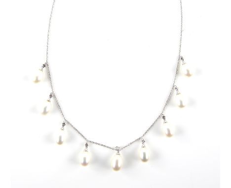 Freshwater pearl and diamond necklace, designed as nine drops, each with a oval shaped freshwater pearl, measuring an average