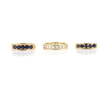 Two matching sapphire half eternity rings, both ring size L 1/2  and one paste full eternity ring, size K 1/2, all mounted in