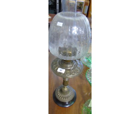 A Brass Oil Lamp with a glass shade