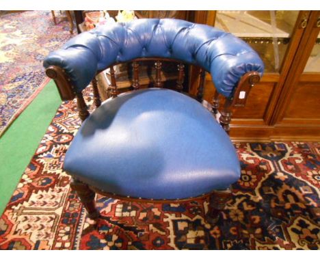 A 19th Century Mahogany Framed Tub Chair with blue leather & studded & upholstery on ceramic castors