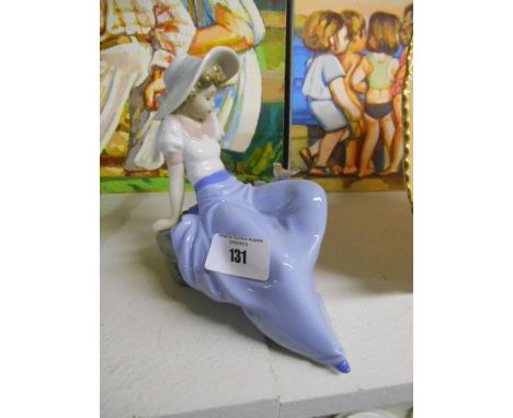 A Nao Figure of a Girl and a Bird
