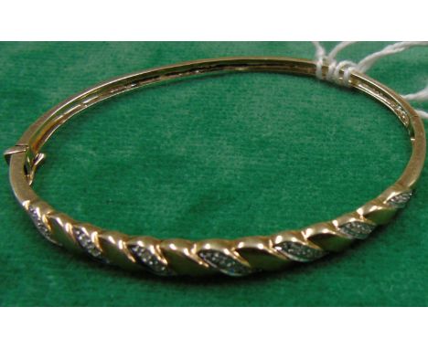 A Gold &amp; Diamond 9ct Bangle.