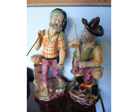 Two Large Ceramic Figures possibility Capodimonte, both depicting fisherman and their catch. The largest 19.5ins in height ap