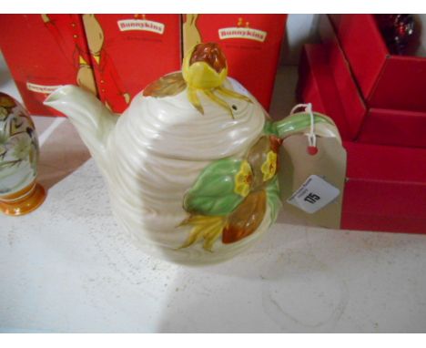 Newport Pottery Clarice Cliff Teapot having foliate decoration in relief on a light brown ground