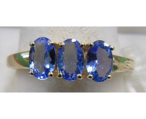 A 9ct Gold Tanzanite Three Stone Ring. Size P.