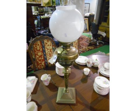 Early 20th Century Oil Lamp having brass reservoir on a brass barley twist column, and opaque glass shade