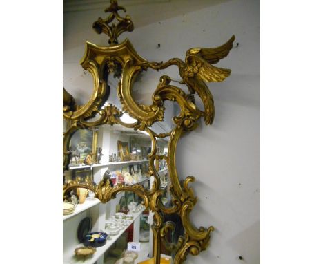 A Fine Antique Chippendale Tradition Gesso and Gilt Carved Wood Cartouche Shaped Mirror with exotic bird mounts. length 52ins
