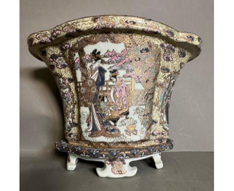 A Famille rose palette planter on plinth with an ornate painted rural scene 