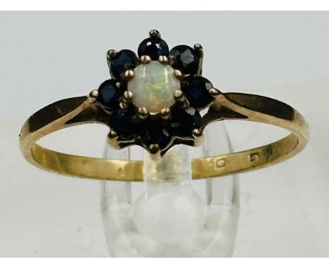 A 9ct gold opal and sapphire ring with an approximate weight of 1.3g and size P