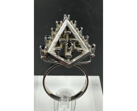 A 14ct white gold fashion ring with sapphires, possibly 1970's, approximate total weight 8.6g Size M