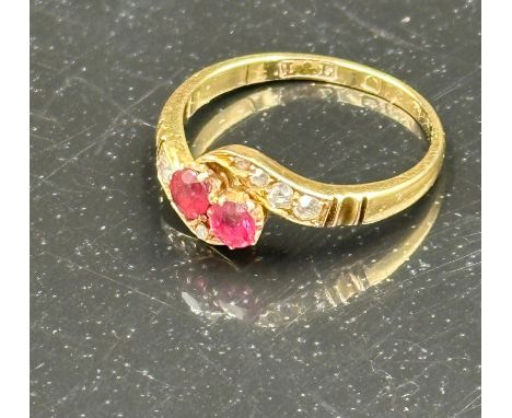 An 18ct gold ruby and diamond ring with an approximate weight of 2.4g