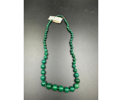 A vintage green glass necklace 