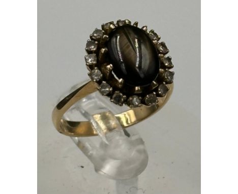 A gold tigers eye ring with diamonds AF SIze M 