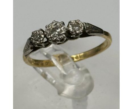 An 18ct gold three stone diamond ring with an approximate weight of 2.4g and size O.