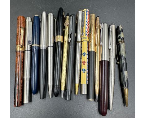 A selection of vintage fountain pens and roller balls to include Parker and Sheaffers 