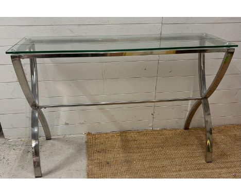 A contemporary chrome and glass X frame console table (H80cm W120cm D40cm)