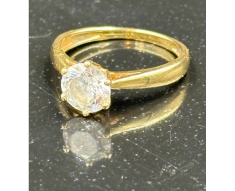 An unmarked gold ring with central CZ stone