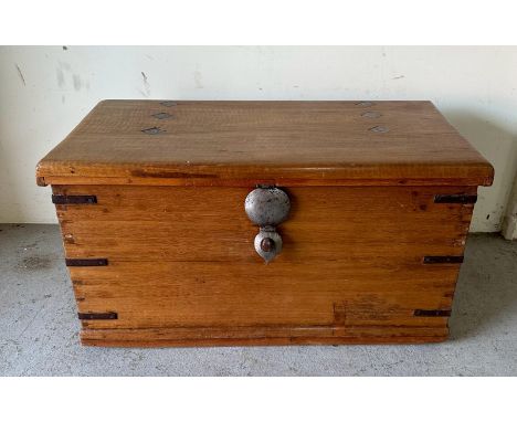 A Middle Eastern style storage trunk with brass handles, metal brackets to corners and diamond inlay tap opening to two panel
