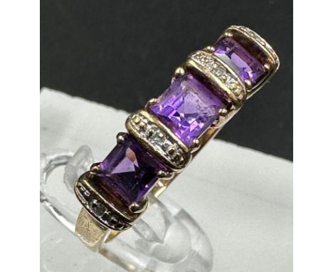 A 9ct gold amethyst and diamond fashion ring. with an approximate total weight of 2.9g and size P